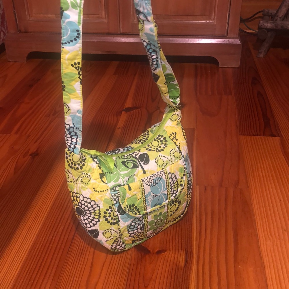 Vera Bradley purse. Colors blue green and white. Measures 9x7x3.5